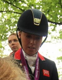 British para-dressage rider Sophie Wells autographing at the 2012 Summer Paralympics.